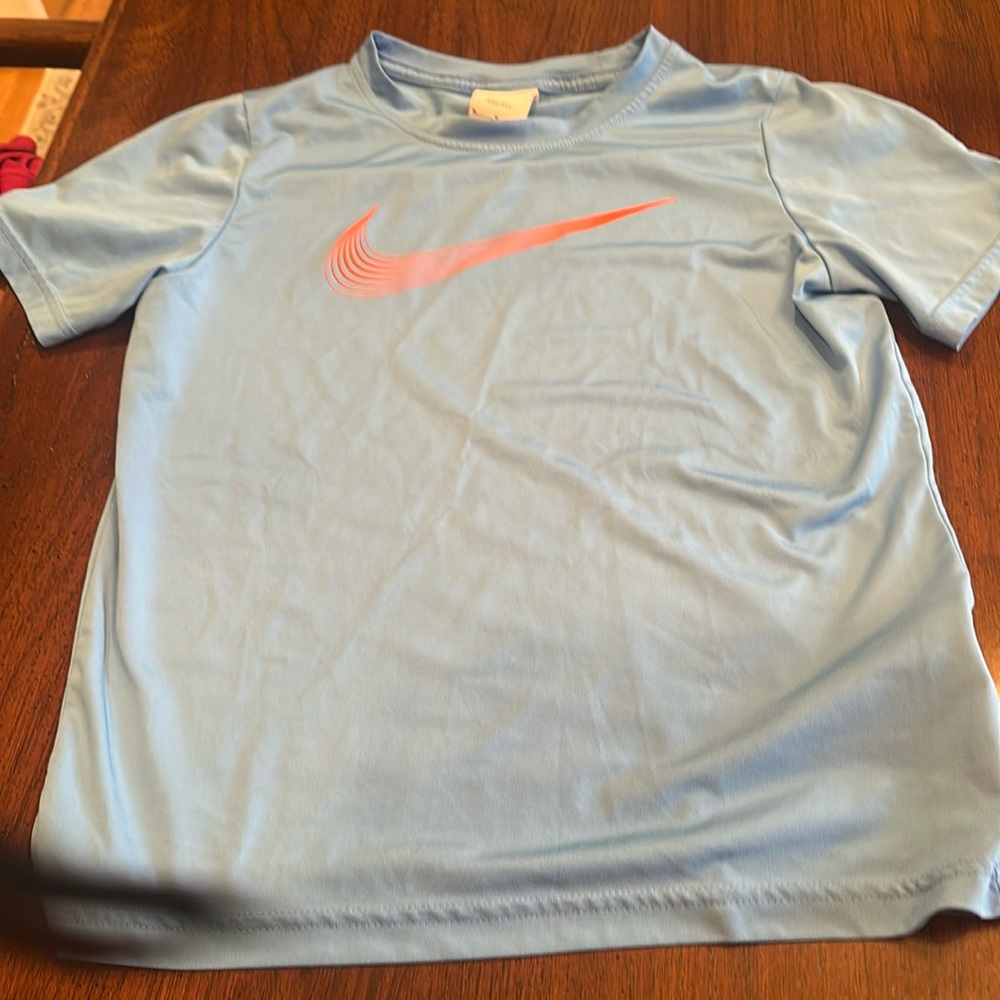 This is a blue and orange Nike tee for boys